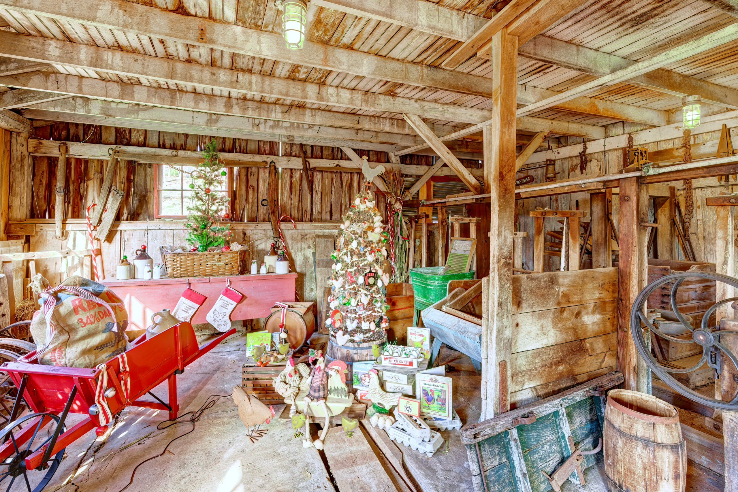 Interior of a vintage barn featuring an egg-themed Christmas tree.